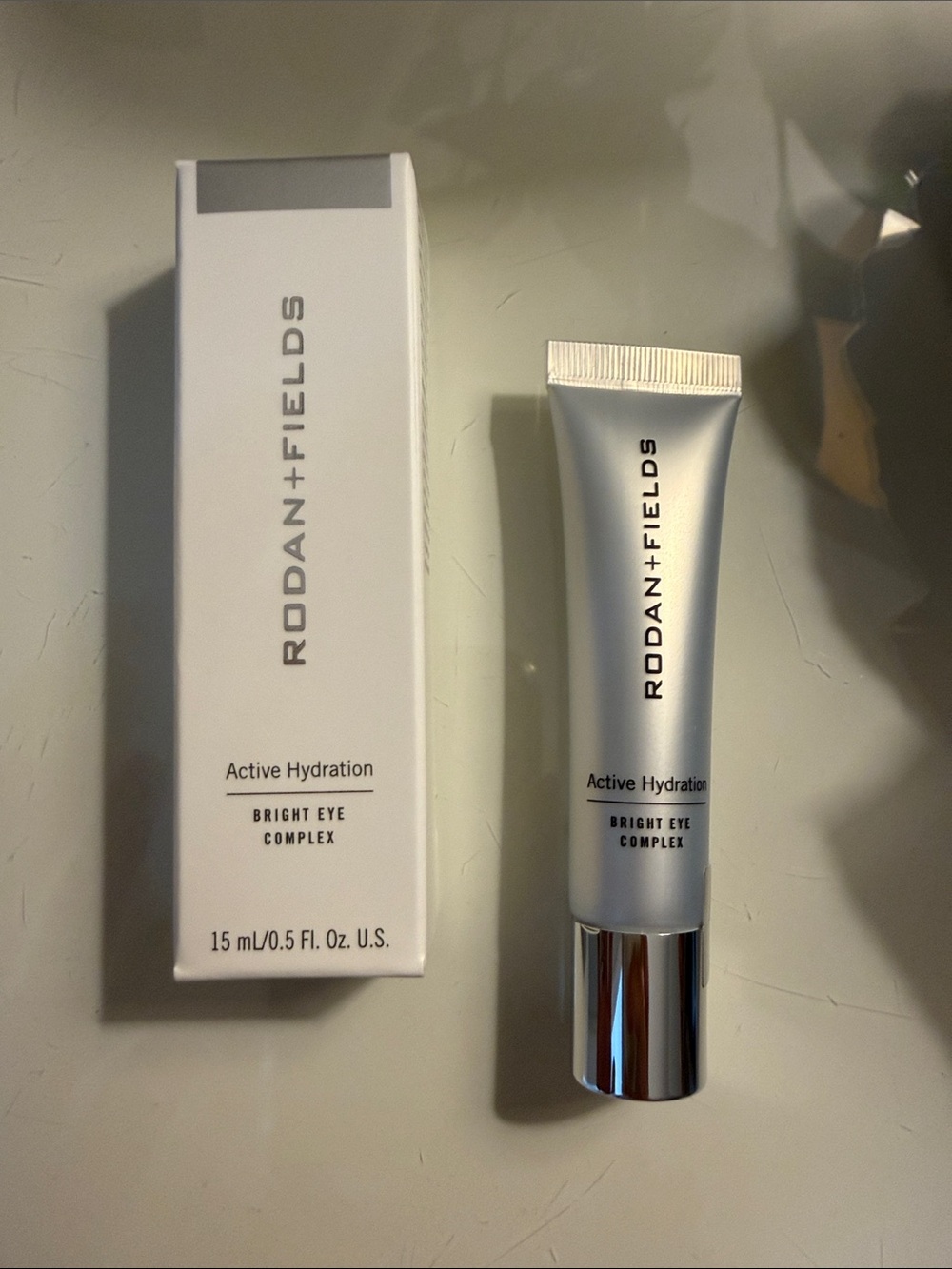 Rodan + Fields Bright Eye Complex - Silver and White